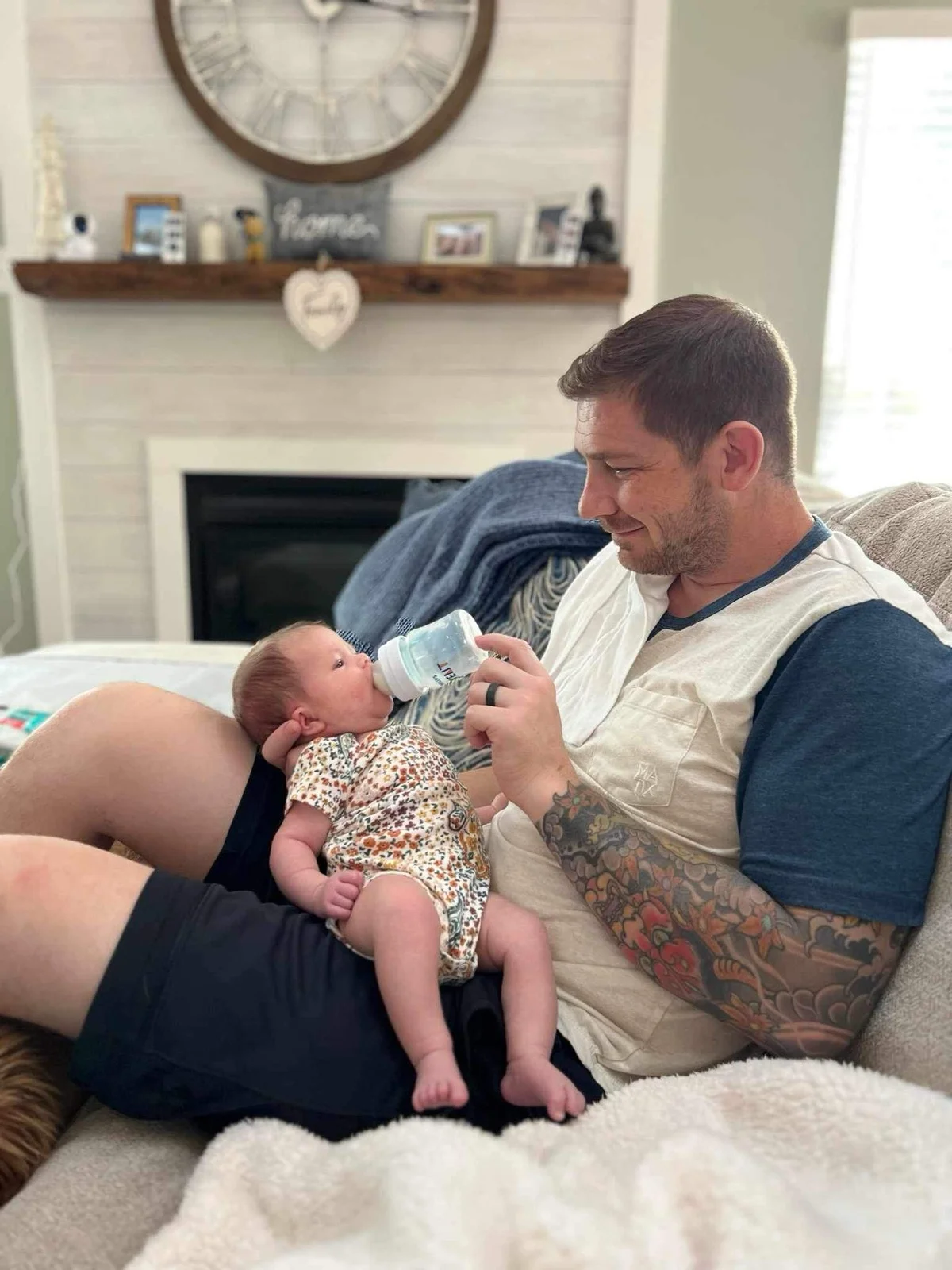 My brother feeding his newborn daughter, my niece. The little girl who almost never got to be here. | Gratitude in sobriety, sober family, living amends, Zac Spowart, Nomadic Addictt