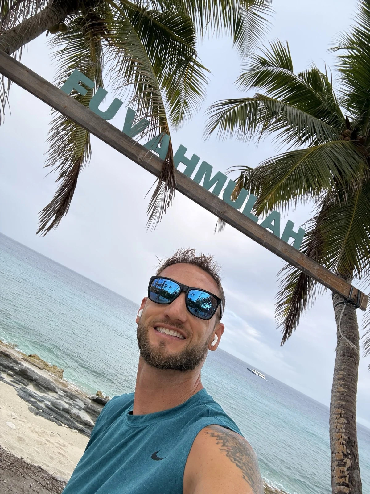 Made it! The Fuvahmulah sign, the palms, and a whole lot of ocean. | Zac Spowart arriving in Fuvahmulah, Maldives for tiger shark diving, sober travel adventure, Nomadic Addictt. Made it! The Fuvahmulah sign, the palms, and a whole lot of ocean. | Zac Spowart arriving in Fuvahmulah, Maldives for tiger shark diving, sober travel adventure, Nomadic Addictt.