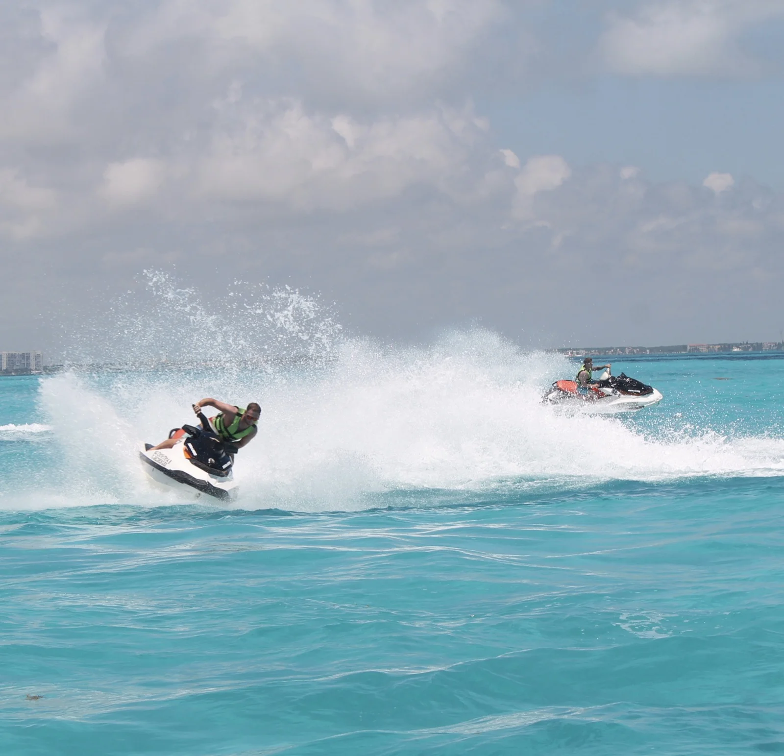 Jet skiing with my brother across turquoise water in Mexico. Sober together. | Sober travel, sober adventures, Zac Spowart, Nomadic Addictt, Zachary Spowart